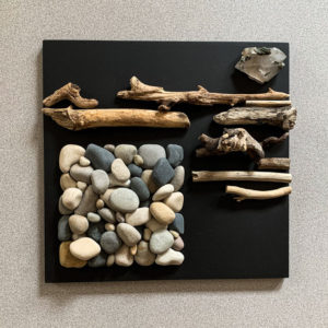 Homage to A Pandemic XXVIII, rock, driftwood, epidote in quartz and painted wood, 12” X 12.”